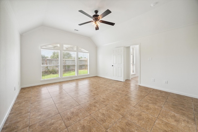 spare room featuring ceiling fan, light tile patterned floors, and lofted ceiling