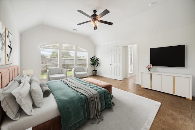 tiled bedroom with ceiling fan and vaulted ceiling