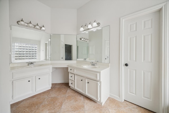 bathroom featuring tile patterned flooring and vanity