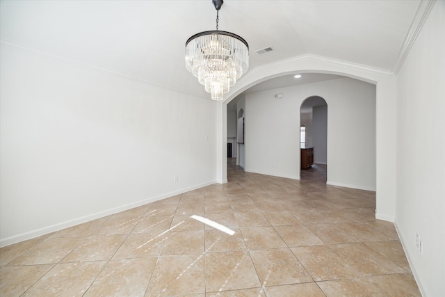 empty room with lofted ceiling, ornamental molding, and a chandelier