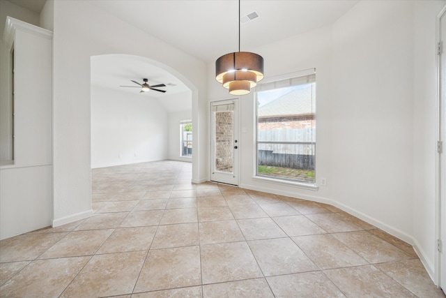 tiled foyer entrance with vaulted ceiling and ceiling fan