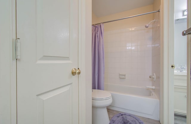 bathroom featuring toilet and shower / bathtub combination with curtain