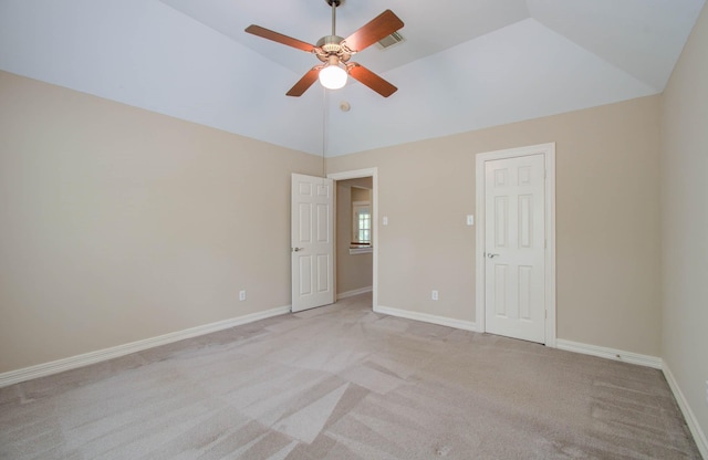 carpeted empty room with lofted ceiling and ceiling fan