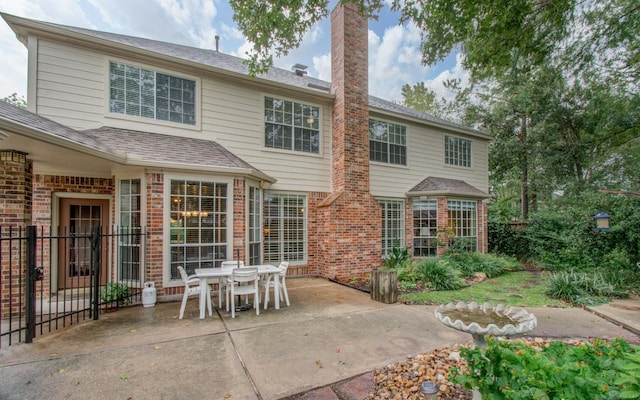 rear view of house featuring a patio area