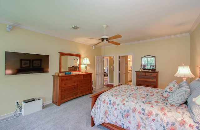 bedroom with light carpet, ceiling fan, ornamental molding, and connected bathroom