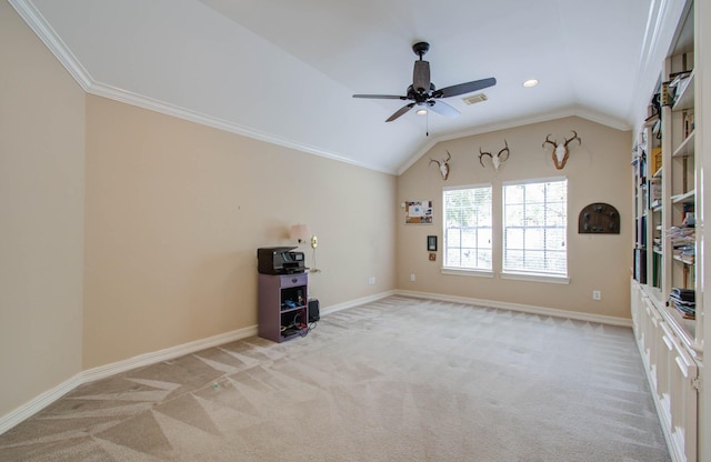 interior space with ceiling fan, lofted ceiling, and ornamental molding