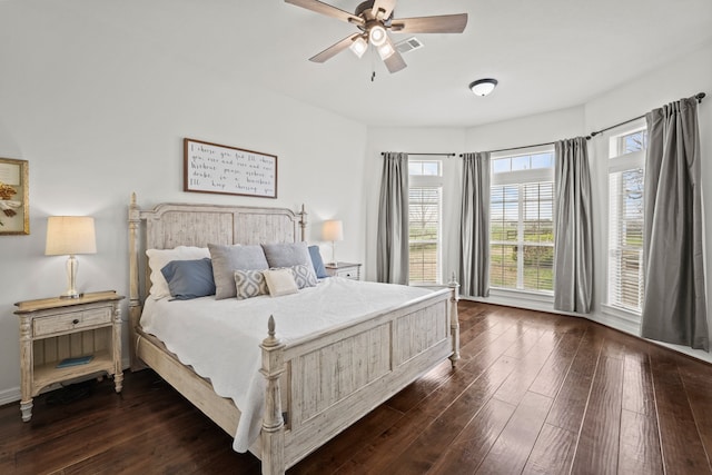 bedroom featuring dark hardwood / wood-style floors and ceiling fan