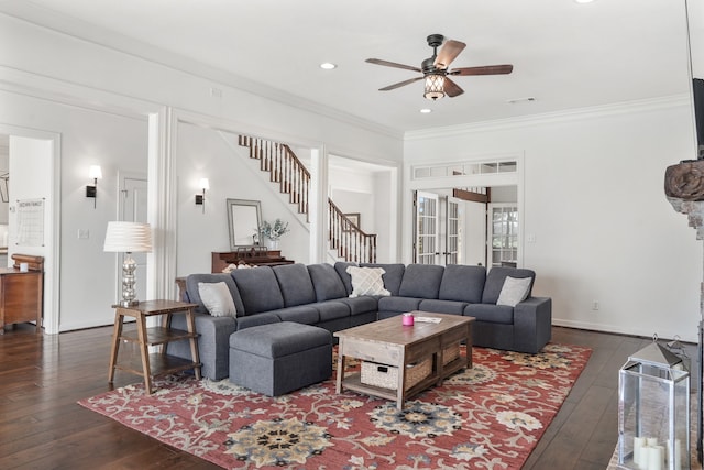 living room with ornamental molding, ceiling fan, and dark hardwood / wood-style floors