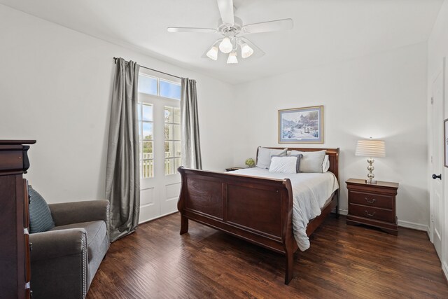 bedroom with ceiling fan and dark hardwood / wood-style floors