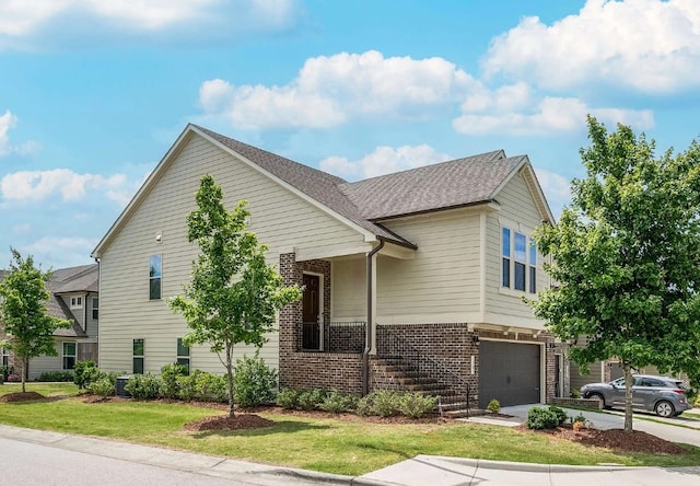 view of front facade featuring a garage and a front lawn