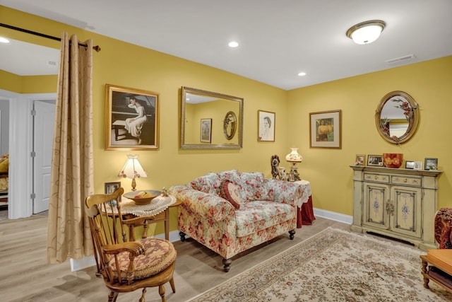 sitting room featuring light hardwood / wood-style floors