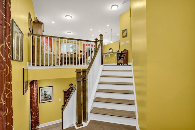 stairway with wood-type flooring