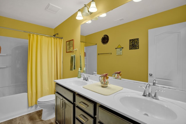 full bathroom featuring shower / bath combo with shower curtain, toilet, wood-type flooring, and vanity