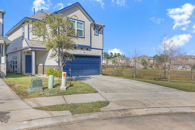 view of front facade with a front yard and a garage