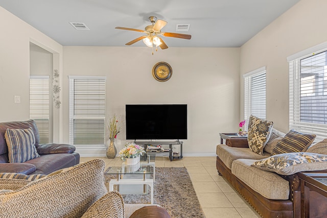 living room featuring ceiling fan and light tile patterned floors