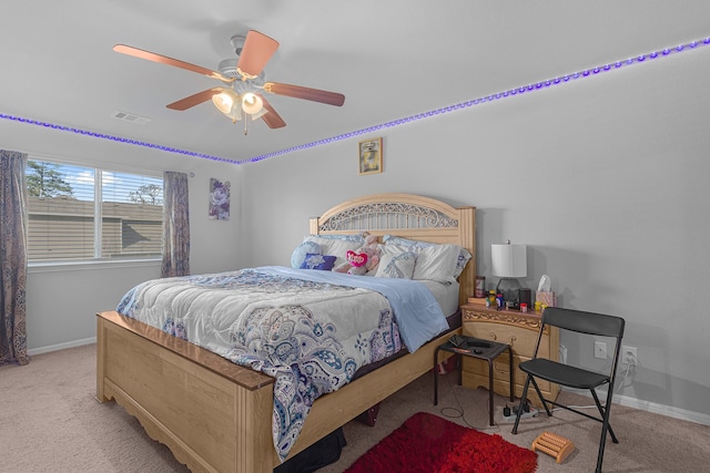 carpeted bedroom featuring ceiling fan