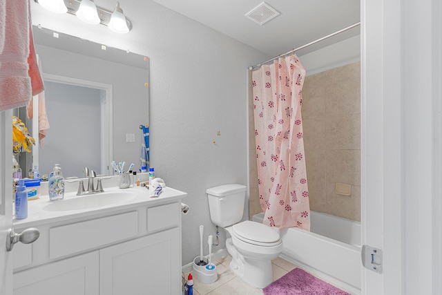 full bathroom featuring vanity, toilet, shower / bath combo with shower curtain, and tile patterned flooring