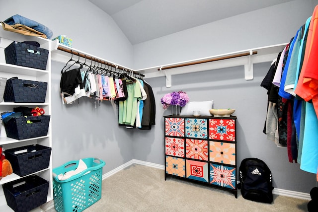 12810 Ilderton Dr, Humble, TX 77346 - walk in closet featuring carpet and vaulted ceiling
