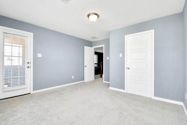 12810 Ilderton Dr, Humble, TX 77346 - unfurnished bedroom with carpet flooring and baseboards
