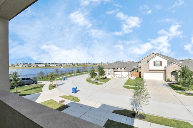 12810 Ilderton Dr, Humble, TX 77346 - exterior space with a water view, a residential view, a garage, and driveway