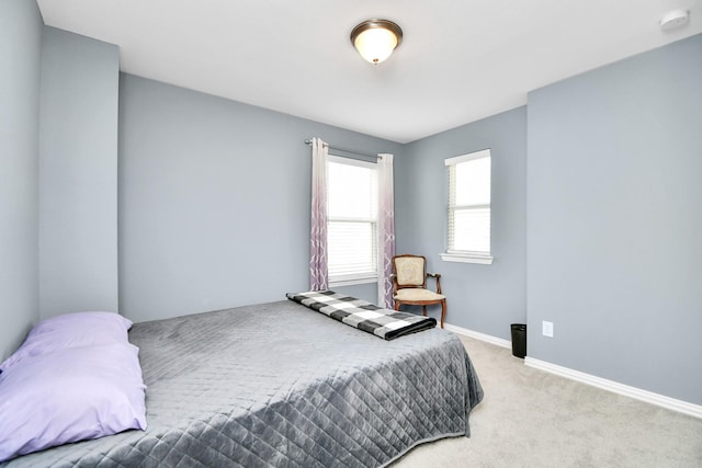 12810 Ilderton Dr, Humble, TX 77346 - bedroom featuring light colored carpet and baseboards