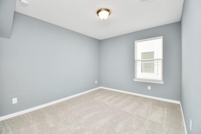 12810 Ilderton Dr, Humble, TX 77346 - spare room featuring carpet, baseboards, and a smoke detector