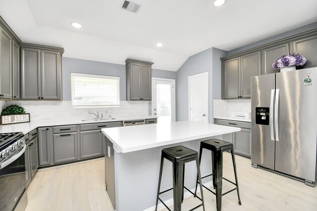 12810 Ilderton Dr, Humble, TX 77346 - kitchen featuring stainless steel appliances, light wood-style floors, a sink, tasteful backsplash, and recessed lighting