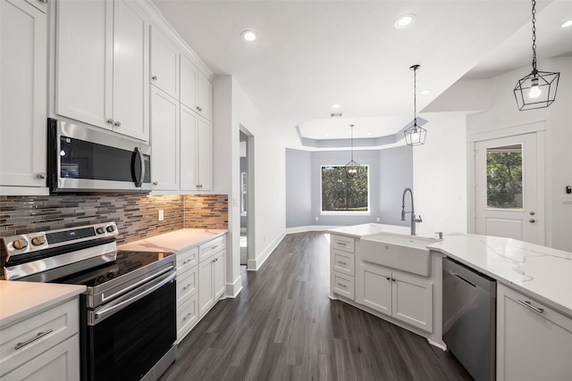 kitchen featuring white cabinets, sink, appliances with stainless steel finishes, and plenty of natural light