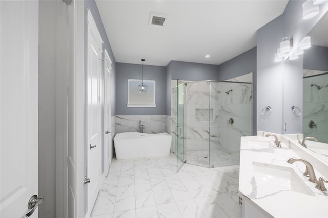 bathroom with vanity, separate shower and tub, and tile walls