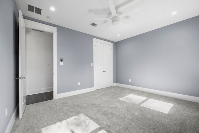 unfurnished bedroom featuring carpet flooring and ceiling fan