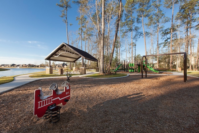 view of jungle gym with a water view