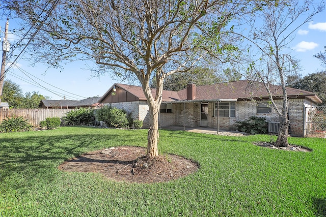 exterior space with a yard, a patio, and central air condition unit