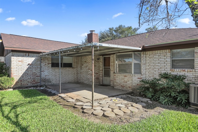 back of property featuring a patio and central AC unit