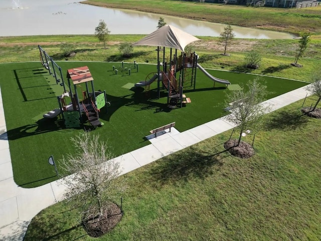 surrounding community with a water view, a playground, and a yard