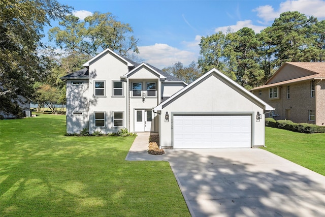 front of property featuring a front lawn and a garage