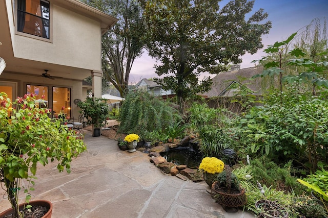 patio terrace at dusk with ceiling fan