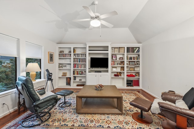 living room featuring hardwood / wood-style flooring, ceiling fan, and lofted ceiling