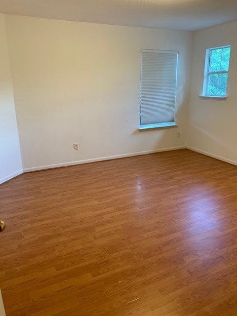 unfurnished room featuring wood-type flooring