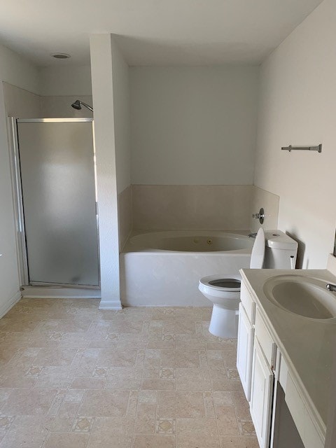 full bathroom with vanity, toilet, and separate shower and tub