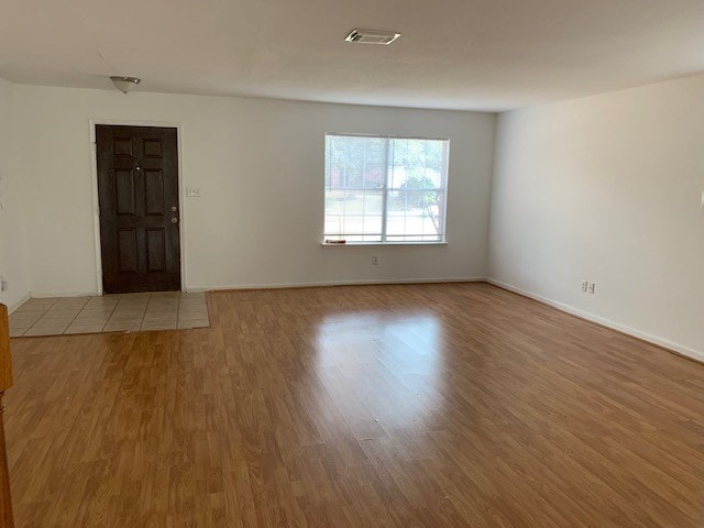 empty room featuring light hardwood / wood-style floors