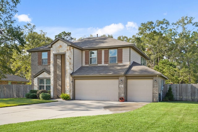 view of front of property with a garage and a front lawn