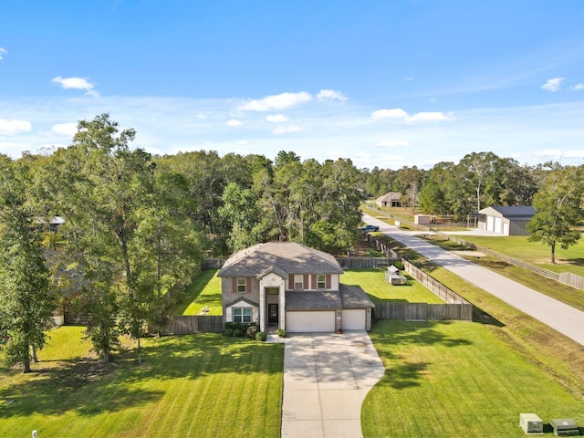 view of front of house featuring a garage and a front yard