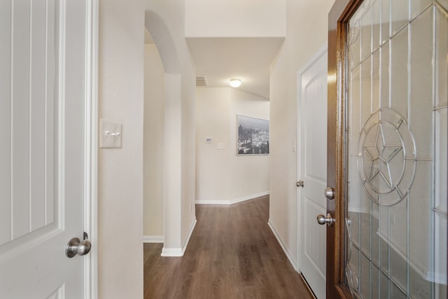 corridor with dark hardwood / wood-style floors