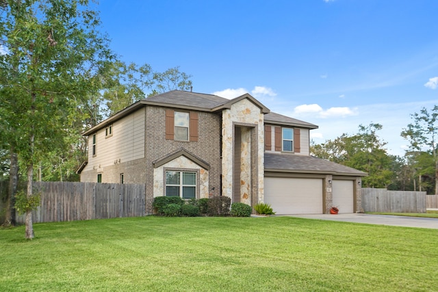 view of property with a garage and a front lawn