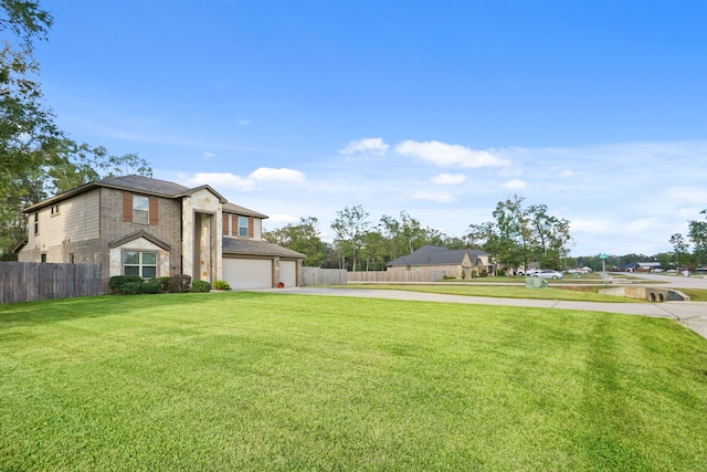 view of front facade with a garage and a front lawn