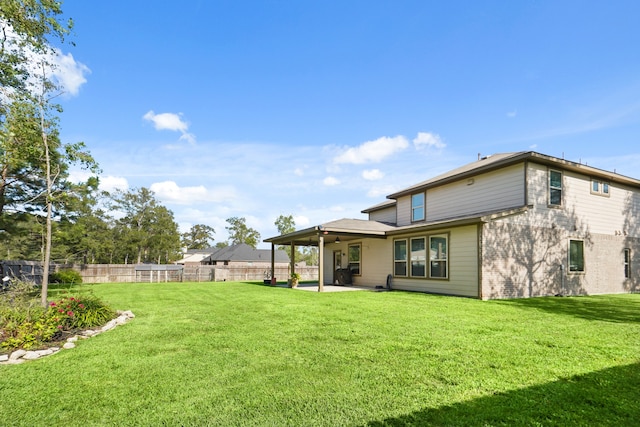 back of property featuring a patio and a lawn