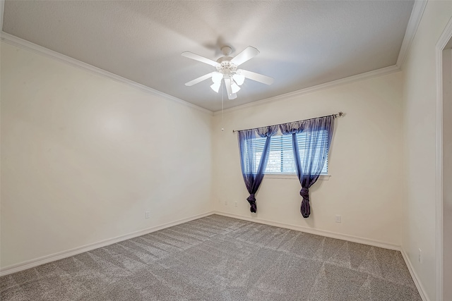 carpeted spare room featuring a textured ceiling, ceiling fan, and ornamental molding