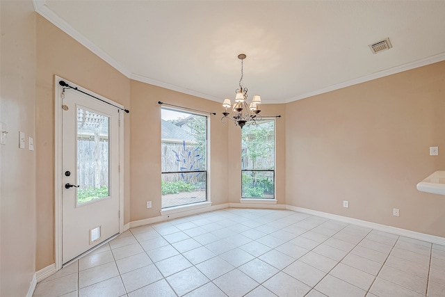 empty room featuring ornamental molding, light tile patterned floors, and a chandelier