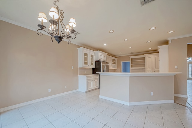 kitchen featuring pendant lighting, light tile patterned floors, crown molding, and a notable chandelier