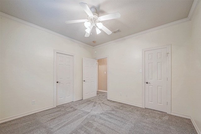 unfurnished bedroom with ceiling fan, light colored carpet, and ornamental molding